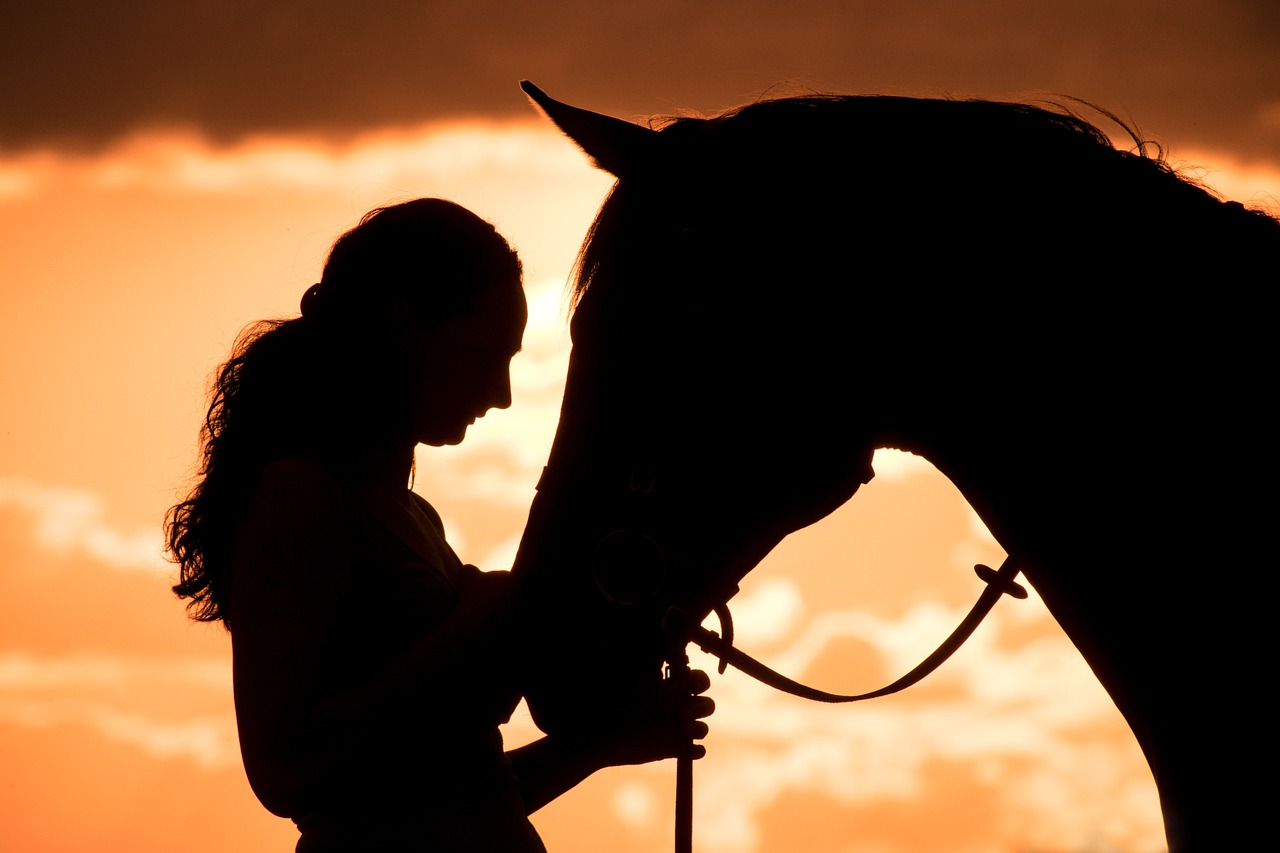 Woman facing horse in communion