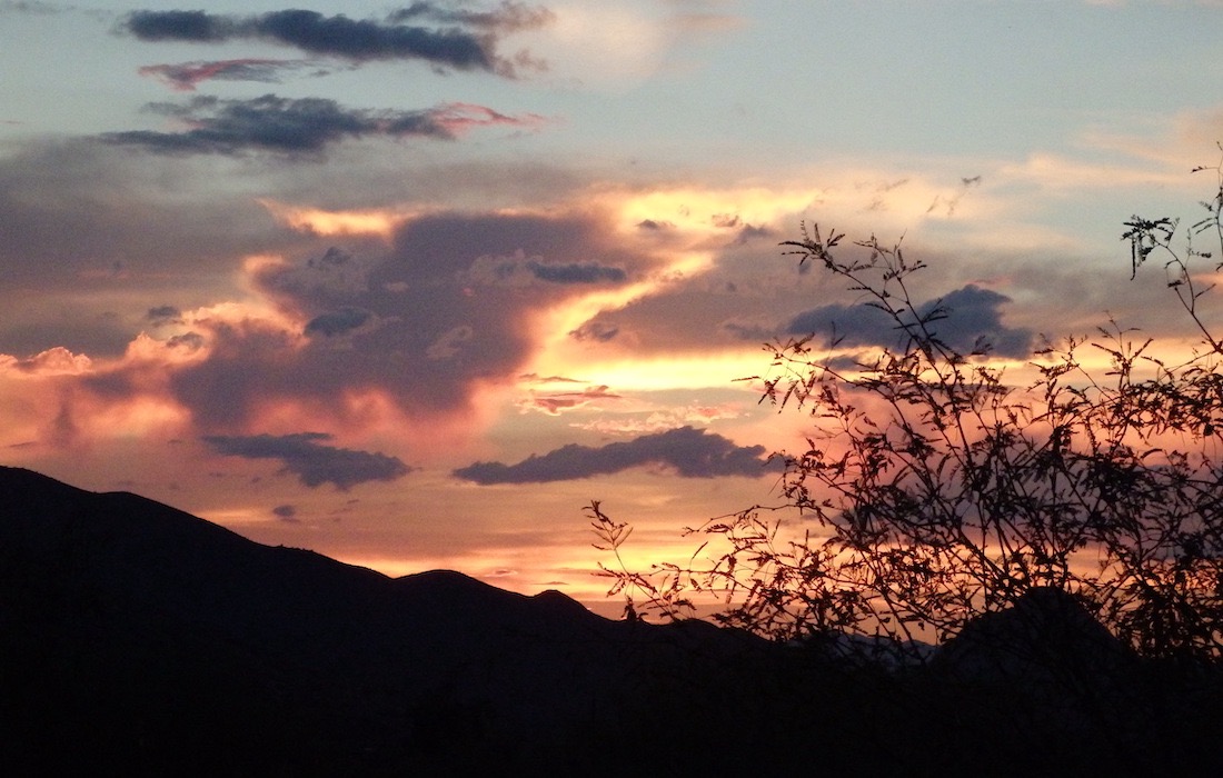 Sunset with clouds, tree, mountain