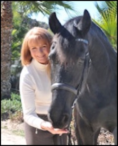 Woman next to black horse