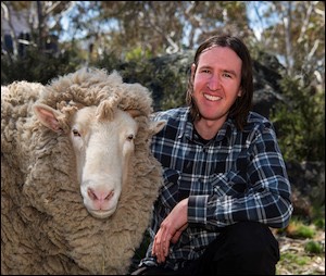 Man next to sheep