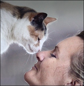 Woman nose to nose with cat
