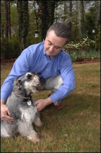 Man with dog looking up at him